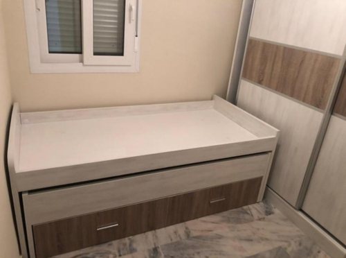 Cama compacta con almacenaje a medida fabricada por Muebles Duarte — proyecto real